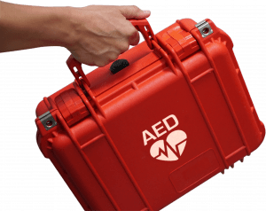 Hand holding AED