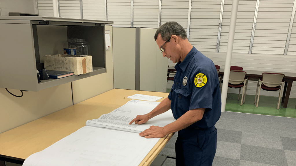 Fire inspector checking a document